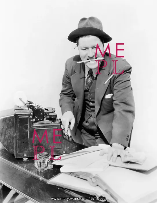 : Bookkeeper with adding machine and pencil in his mouth : Bookkeeper with adding machine and pencil in his mouth