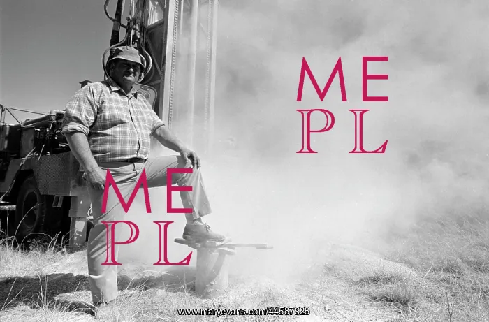 : Borehole drilling. A White man standing in front : Borehole drilling. A White man standing in front