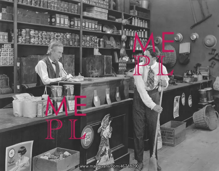 : Boss watching employee sweeping floor in store : Boss watching employee sweeping floor in store