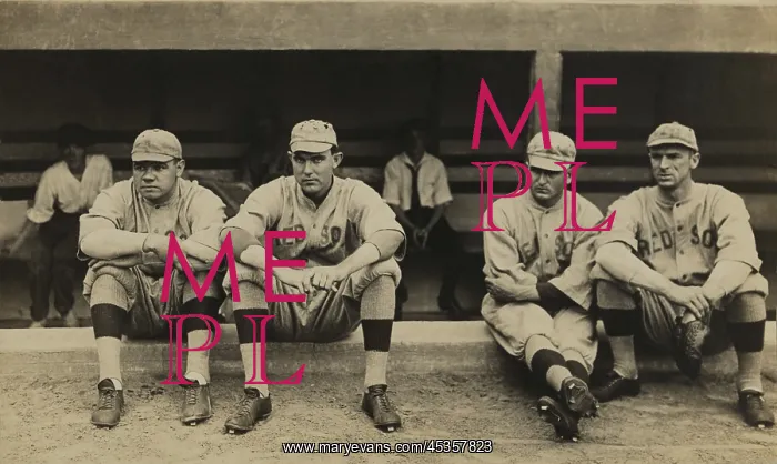 : Boston Red Sox players sitting in front of their : Boston Red Sox players sitting in front of their