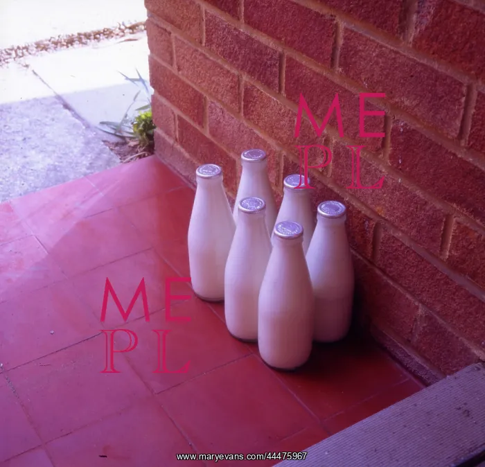 : Six bottles of silver-top milk on the doorstep