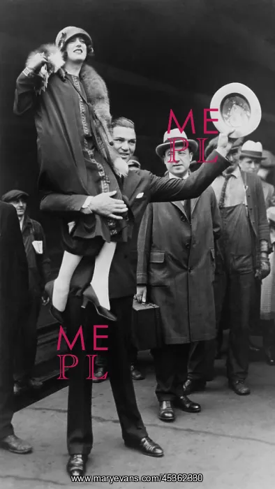 : Boxer Jack Dempsey in Chicago, hoisting his bride : Boxer Jack Dempsey in Chicago, hoisting his bride