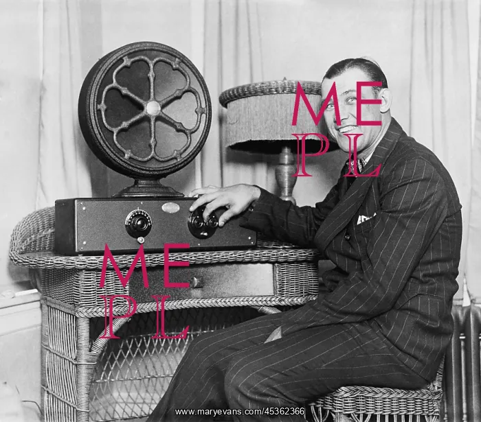 : Boxer Jack Sharkey at a radio with external speaker : Boxer Jack Sharkey at a radio with external speaker