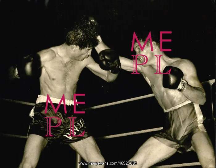 : Boxing. Jul. 07, 1957 - Hair-raiser: Dave Charnley of Dartford, right, swigs a right : Boxing. Jul. 07, 1957 - Hair-raiser: Dave Charnley of Dartford, right, swigs a right