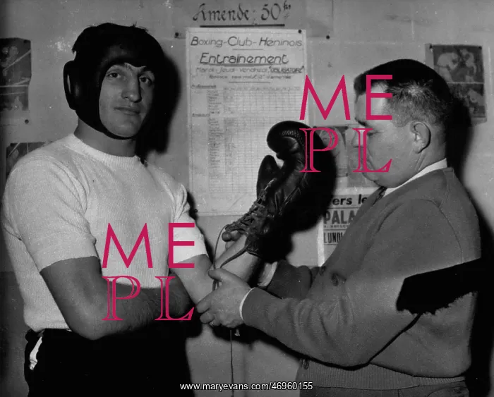 : Boxing. Dec. 26 Charles Humez has his boxing gloves tied on by his manager, M : Boxing. Dec. 26 Charles Humez has his boxing gloves tied on by his manager, M