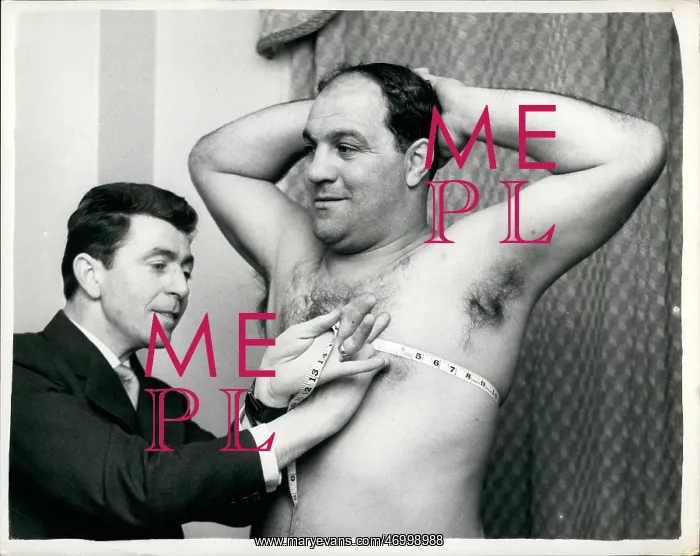 : Boxing. Jan. 01, 1962 - Rocky Marciano gets measured for a Tuxedo : Boxing. Jan. 01, 1962 - Rocky Marciano gets measured for a Tuxedo