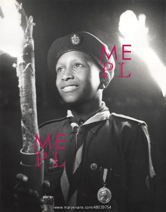 : Boy of 3rd Bahamas Scout Troop in torchlight parade : Boy of 3rd Bahamas Scout Troop in torchlight parade