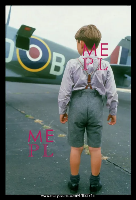 : BOY ADMIRES SPITFIRE : BOY ADMIRES SPITFIRE