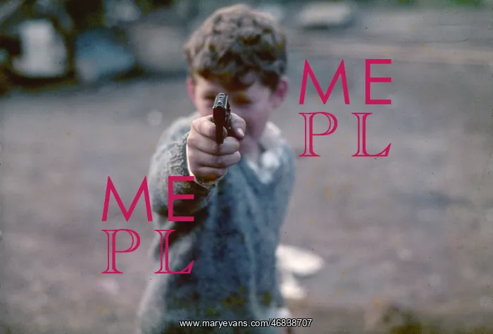 : Boy aims a gun at the camera in West London : Boy aims a gun at the camera in West London