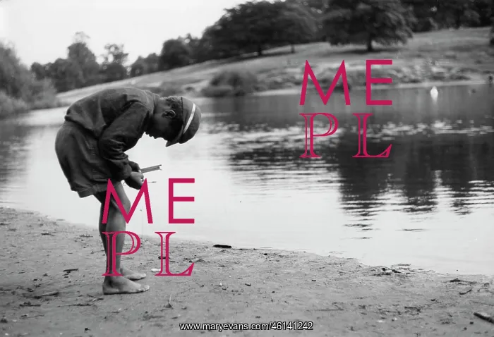 : Boy arranging a fishing line and float : Boy arranging a fishing line and float