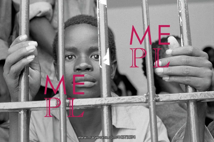 : Boy behind bars, after arrest by Bophuthatswana police : Boy behind bars, after arrest by Bophuthatswana police