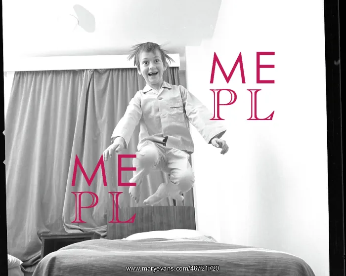 : Boy bouncing up and down on a bed : Boy bouncing up and down on a bed