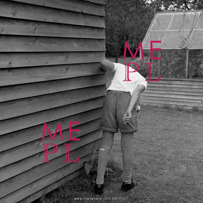 : Boy with cigarette behind the garden shed : Boy with cigarette behind the garden shed