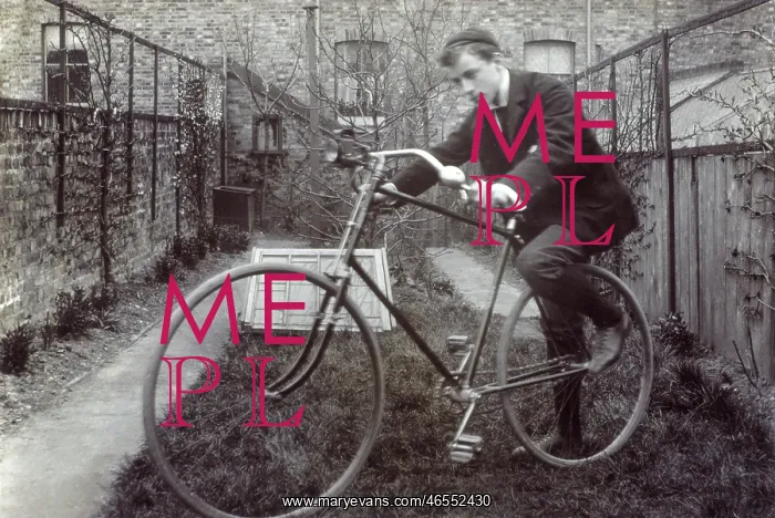 : Boy getting on to his new Bicycle : Boy getting on to his new Bicycle