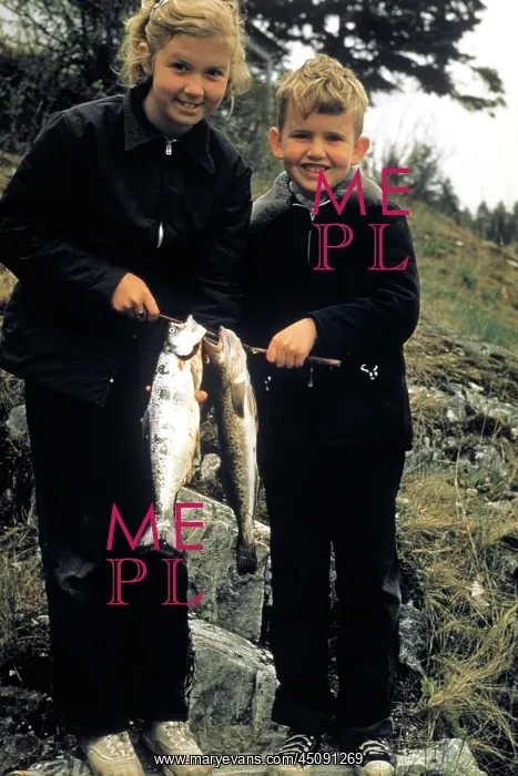 : Boy and Girl Holding up Two Fish Catch of the : Boy and Girl Holding up Two Fish Catch of the