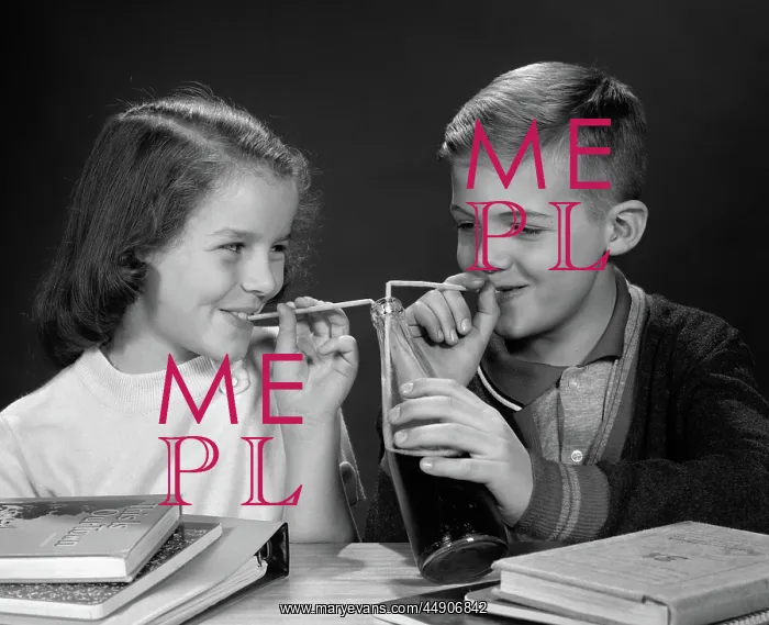: Boy and girl sharing single bottle of soda with : Boy and girl sharing single bottle of soda with