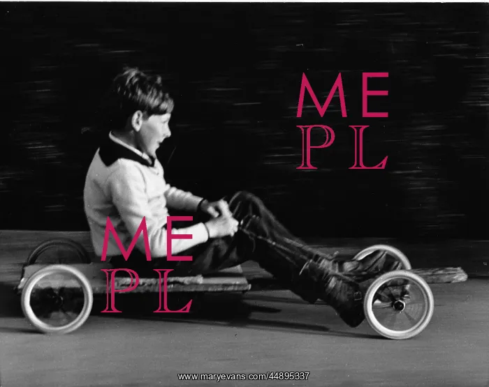 : Boy on a home-made go-kart : Boy on a home-made go-kart