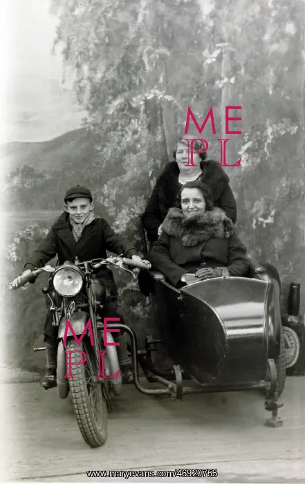 : Boy & ladies on a 1929 Coventry Eagle in a studio : Boy & ladies on a 1929 Coventry Eagle in a studio