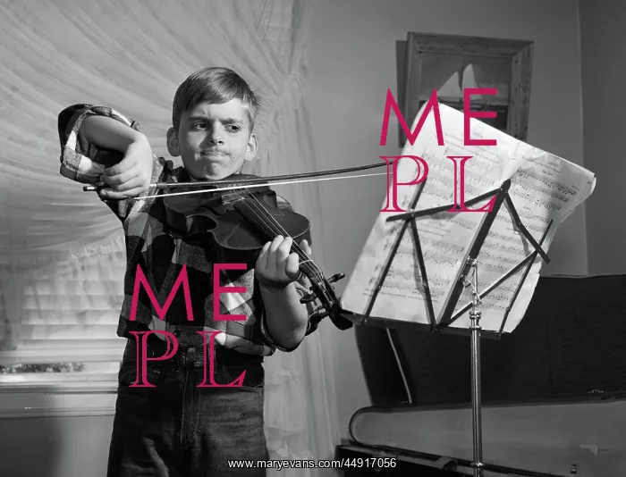 : Boy in living room practicing violin with determined : Boy in living room practicing violin with determined