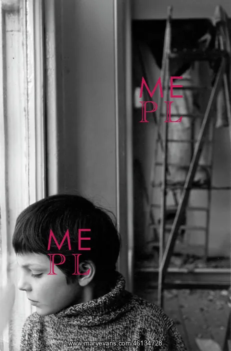 : Boy looking thoughtfully downwards through a window : Boy looking thoughtfully downwards through a window