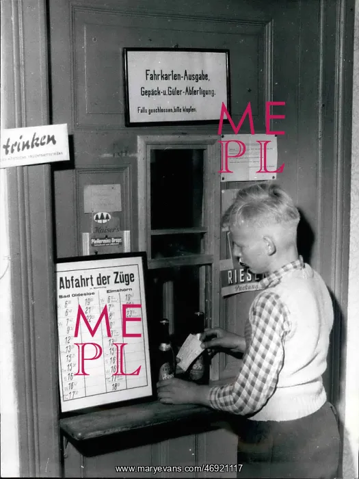 : Boy orders tickets and beer, Blumendorf station, Germany : Boy orders tickets and beer, Blumendorf station, Germany
