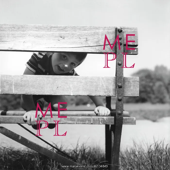 : Boy peeping through a bench : Boy peeping through a bench