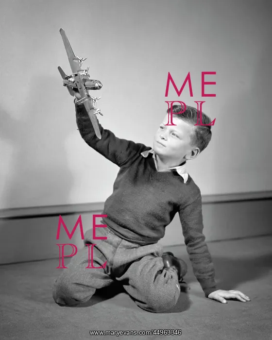: Boy Playing with Toy Model of Four Engine Propellor : Boy Playing with Toy Model of Four Engine Propellor