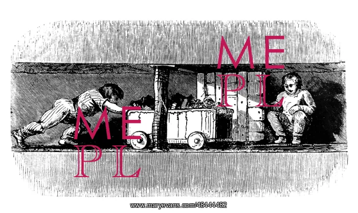 : Boy pushing a truck loaded with coal from the : Boy pushing a truck loaded with coal from the