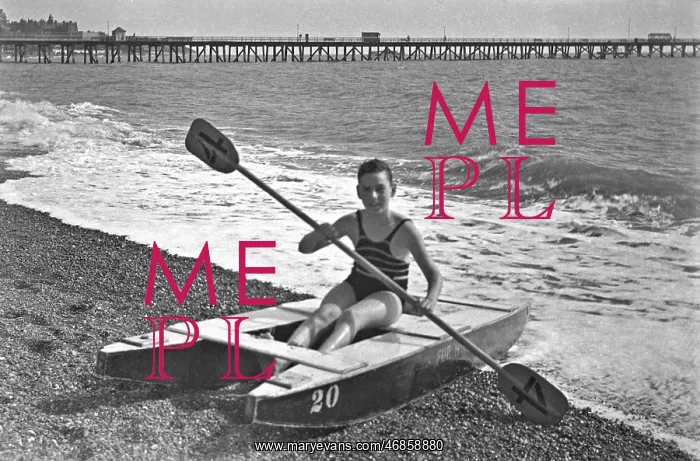  : Boy at the seaside on a raft