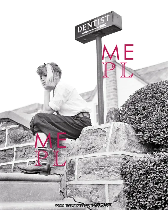 : Boy Sitting on Stone Wall under a Sign Pointing to Dentist : Boy Sitting on Stone Wall under a Sign Pointing to Dentist