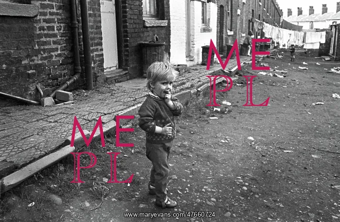 : Boy in slum housing yard : Boy in slum housing yard