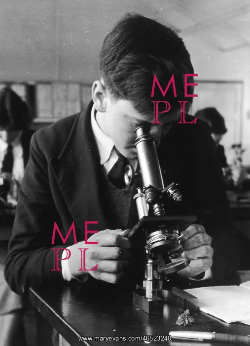  : BOY USING MICROSCOPE