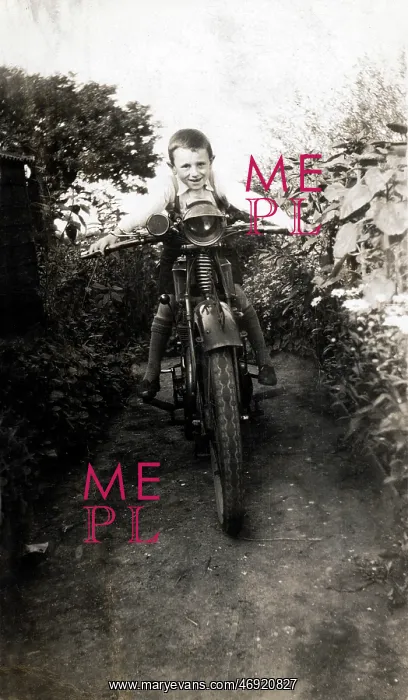 : Boy on a veteran motorcycle : Boy on a veteran motorcycle