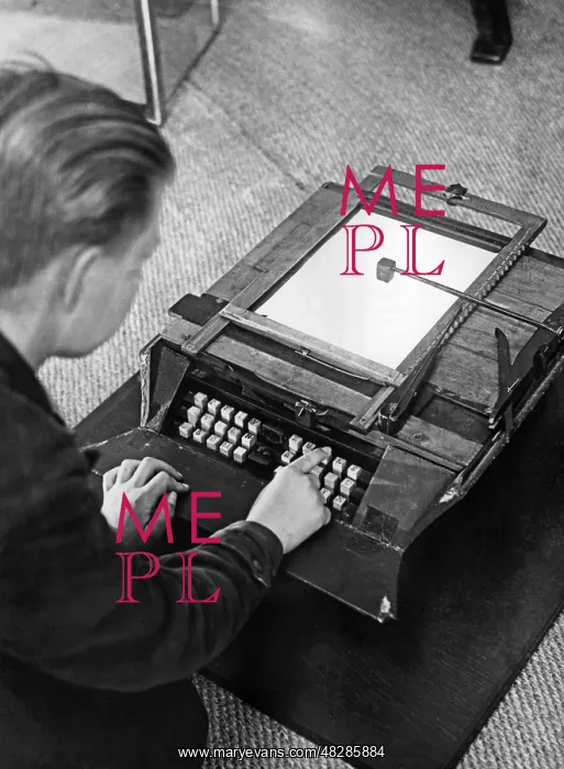  : A boy writes on the first German typewriter, around the