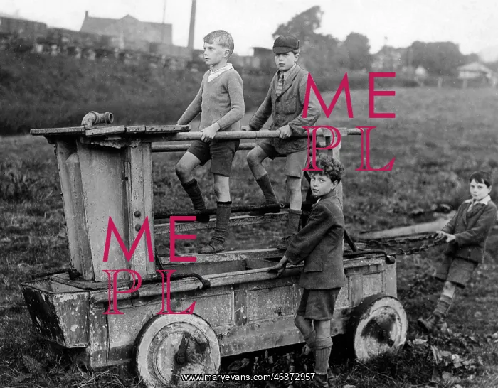 : Boys on an 18th century fire engine, Wirksworth : Boys on an 18th century fire engine, Wirksworth