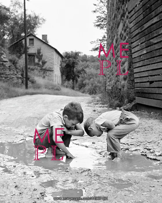 : Two Boys Bending Looking at Playing in Mud Puddle : Two Boys Bending Looking at Playing in Mud Puddle