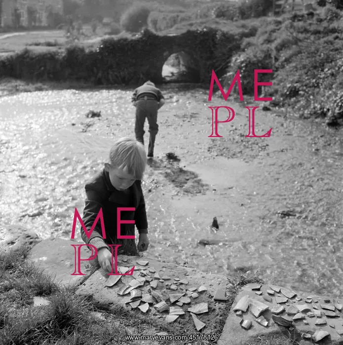 : Boys collecting pottery pieces : Boys collecting pottery pieces