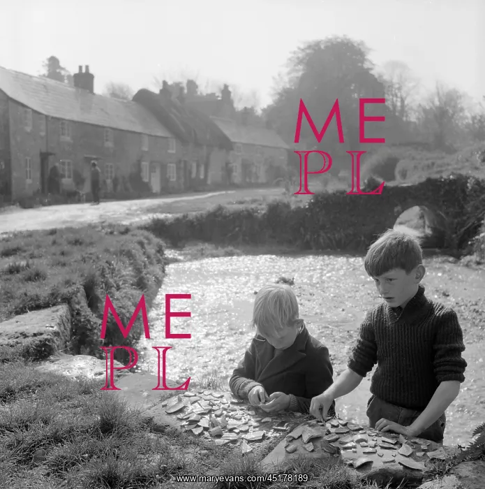 : Boys collecting pottery pieces : Boys collecting pottery pieces