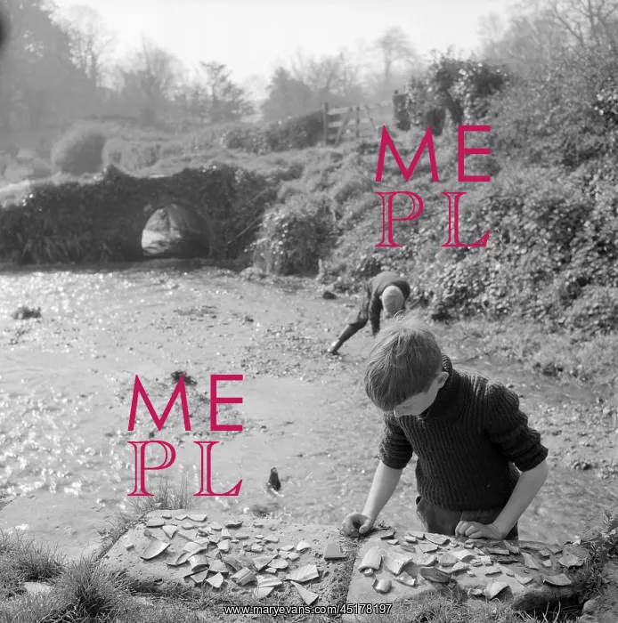 : Boys collecting pottery pieces : Boys collecting pottery pieces