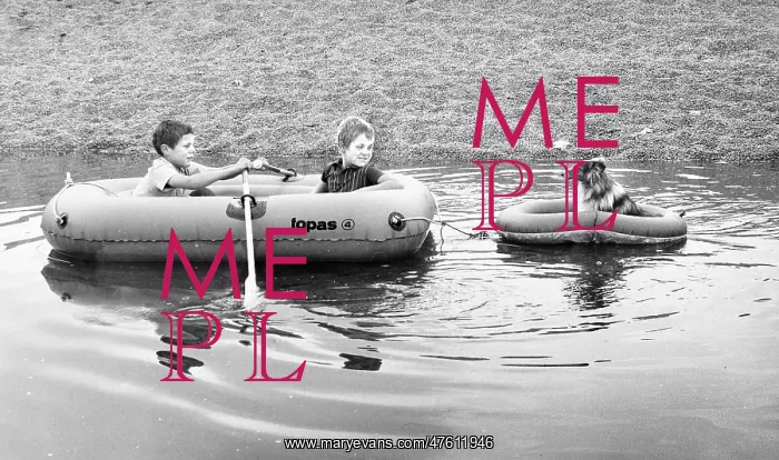 : Two boys and a dog in rubber dinghies : Two boys and a dog in rubber dinghies