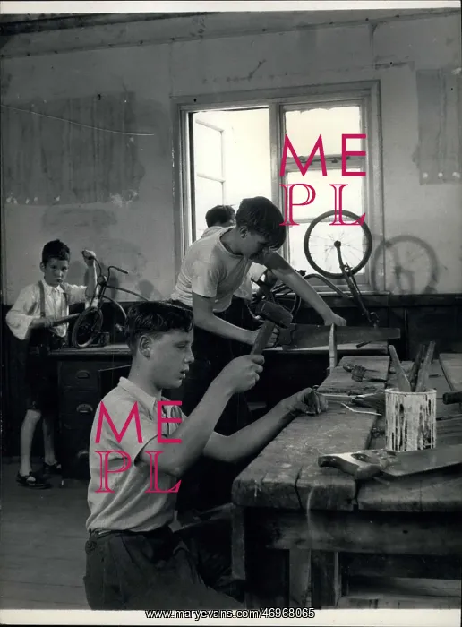 : Boys doing woodwork and repairing bicycles : Boys doing woodwork and repairing bicycles