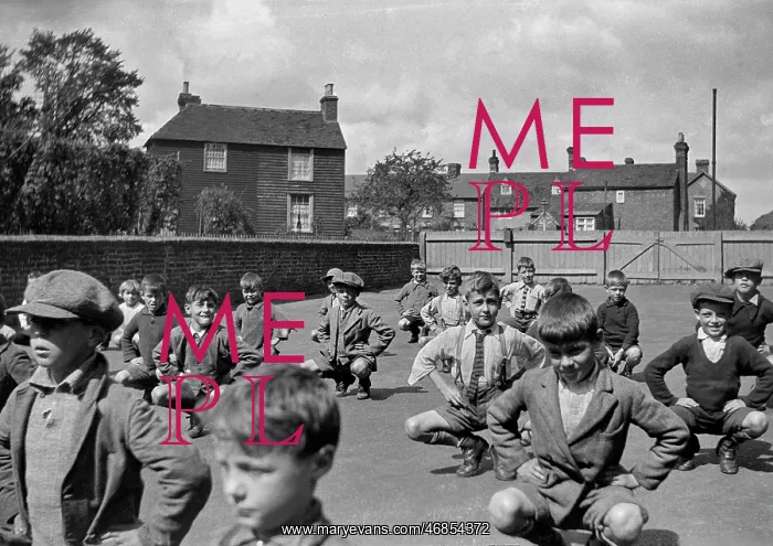 : Boys exercising in school playground : Boys exercising in school playground