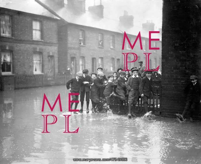 : Boys having fun during Medway floods, Kent : Boys having fun during Medway floods, Kent