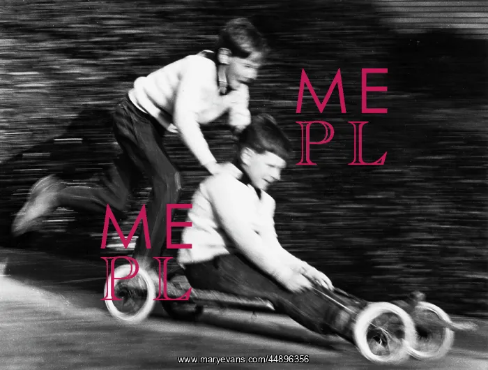 : Two boys on a home-made go-kart : Two boys on a home-made go-kart