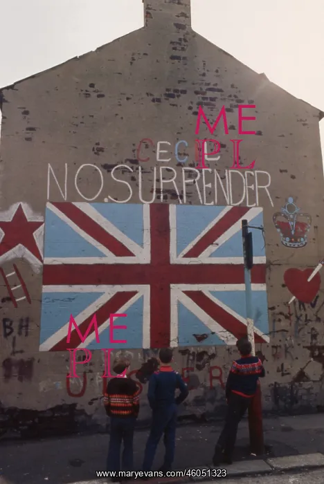: Three boys looking at graffiti, Northern Ireland : Three boys looking at graffiti, Northern Ireland