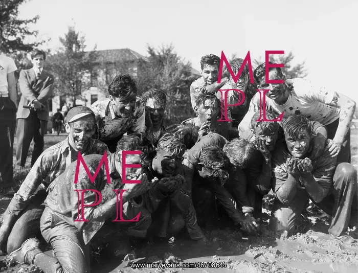 : Boys in muddy fraternity initiation : Boys in muddy fraternity initiation