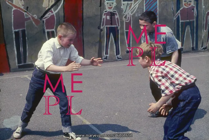 : Three boys in the playground at a Kilburn school : Three boys in the playground at a Kilburn school