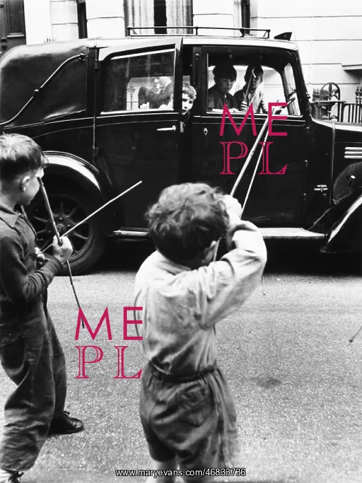 : Boys playing bows and arrows with a car : Boys playing bows and arrows with a car