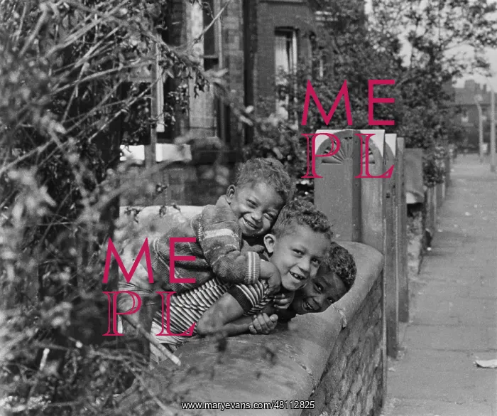 : Three boys playing in a front garden : Three boys playing in a front garden
