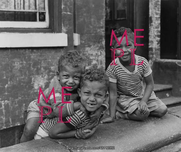 : Three boys playing in a front garden : Three boys playing in a front garden